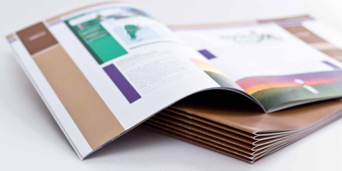 A stack of printed booklets in short focus.